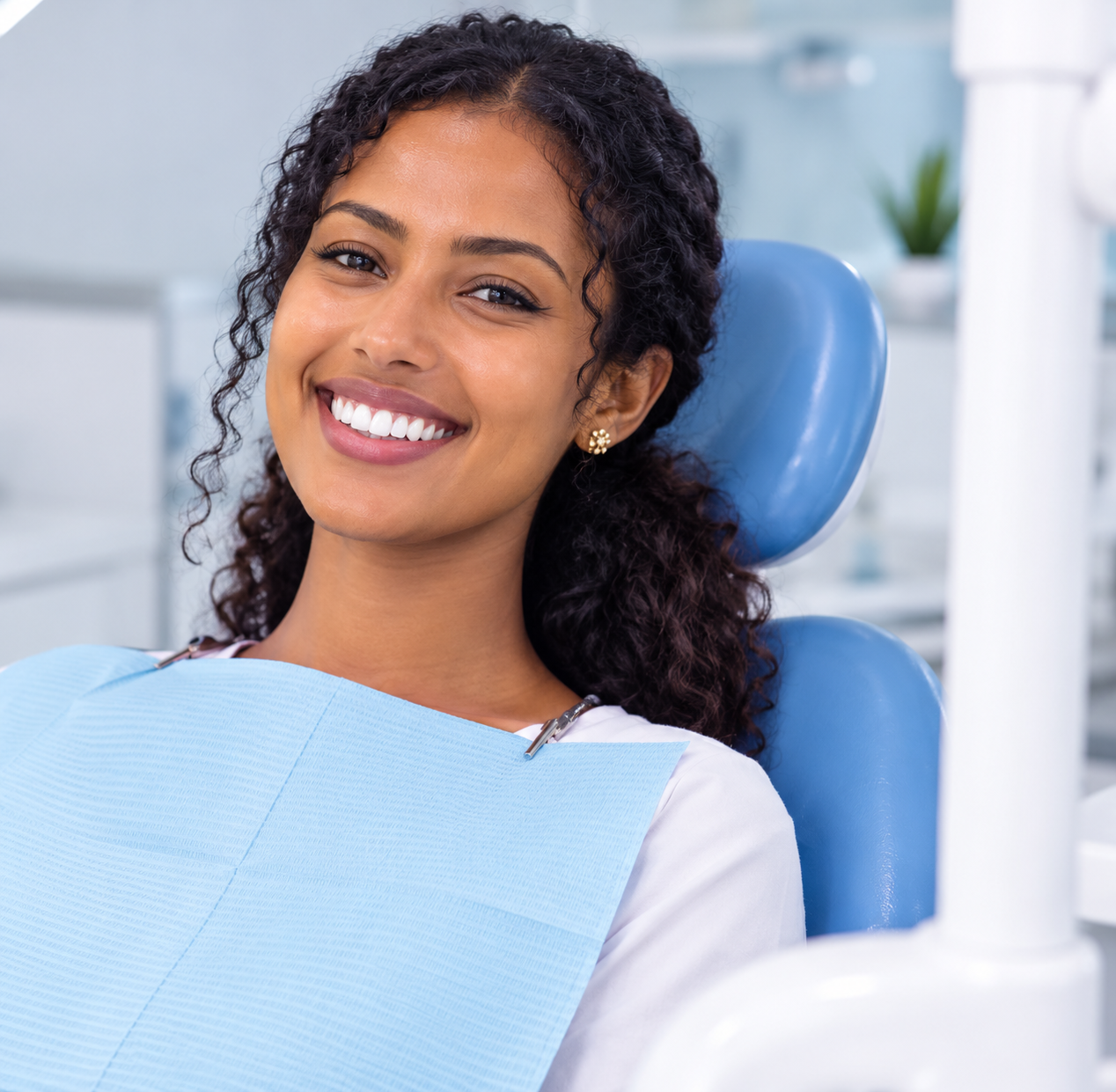 Happy Patient Smiling in Dental Chair